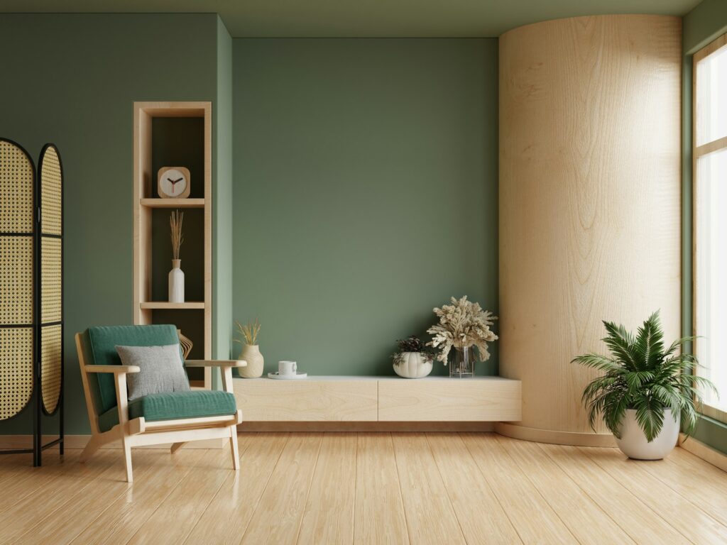 Living room interior has an green armchair on empty dark green wall background
